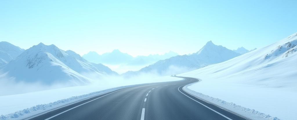 Strada panoramica svizzera con montagne innevate e cielo azzurro